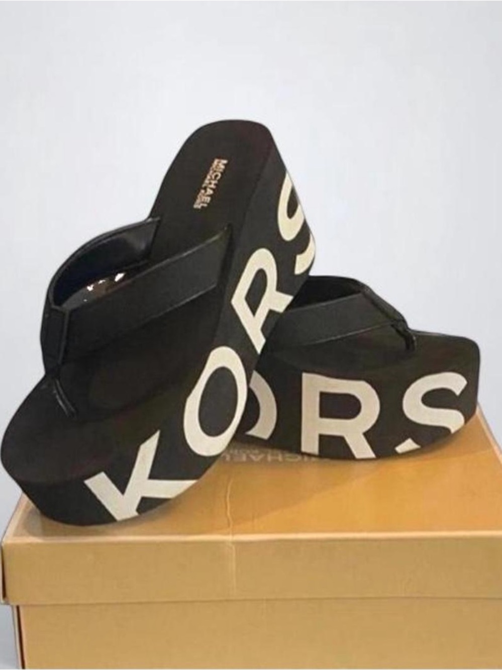 MICHAEL Michael Kors Benny Wedge Black & White Graphic Logo Flip-Flop 8M